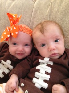 Twins in their football onesies