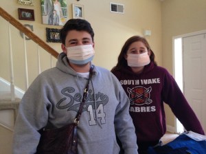 Dalton and Savannah preparing to ride home to NC with Papa and Nana-- yep, those are surgical masks. 